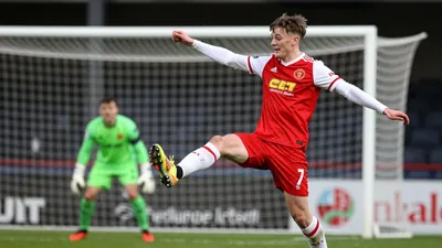 Cliftonville FC secured a 3-0 win over Bangor at Clandeboye Park, with Kyle McClelland scoring his first goal for the Reds